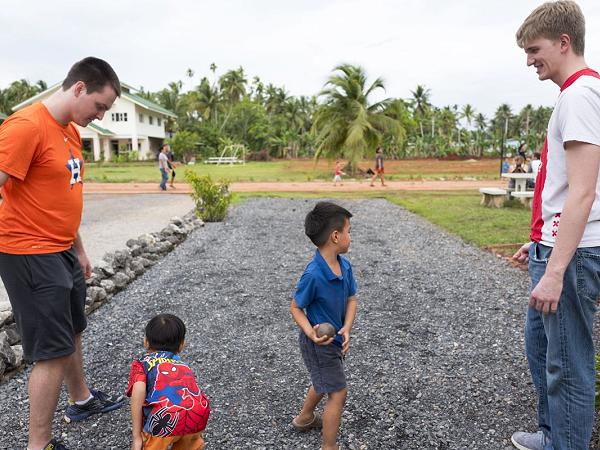 Volunteers and children at the Felix Family Village, Thailand